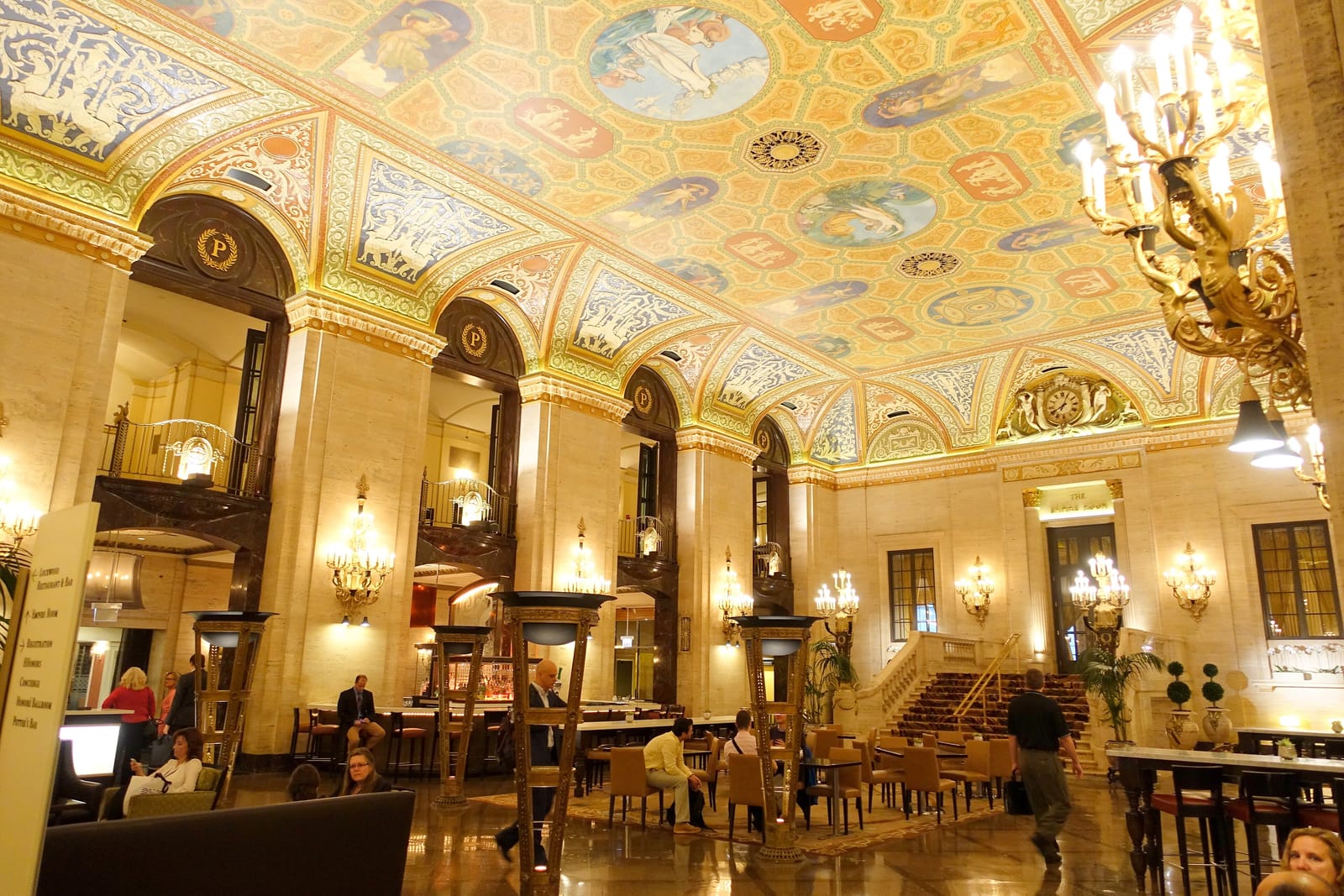 The Palmer House Hilton lobby in Chicago, with its painted ceiling, gilded chandeliers and monogrammed arches